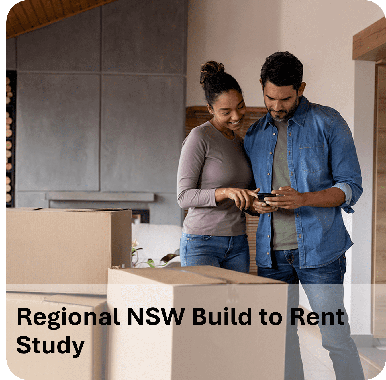 Two people reviewing documents in a modern kitchen with moving boxes.