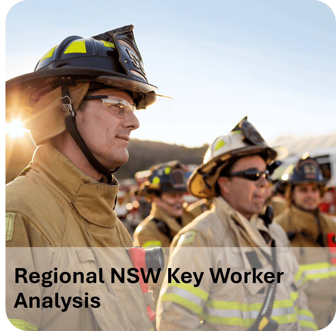 Firefighters in protective gear working during sunset.