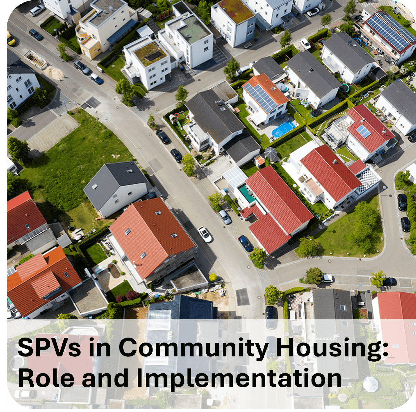 A suburban community with various housing units and parked cars.