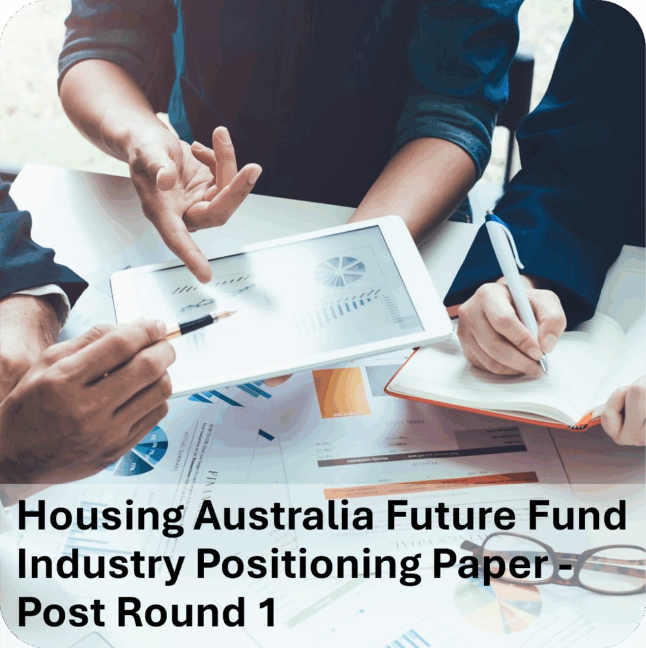 Team analyzing housing fund charts on tablet