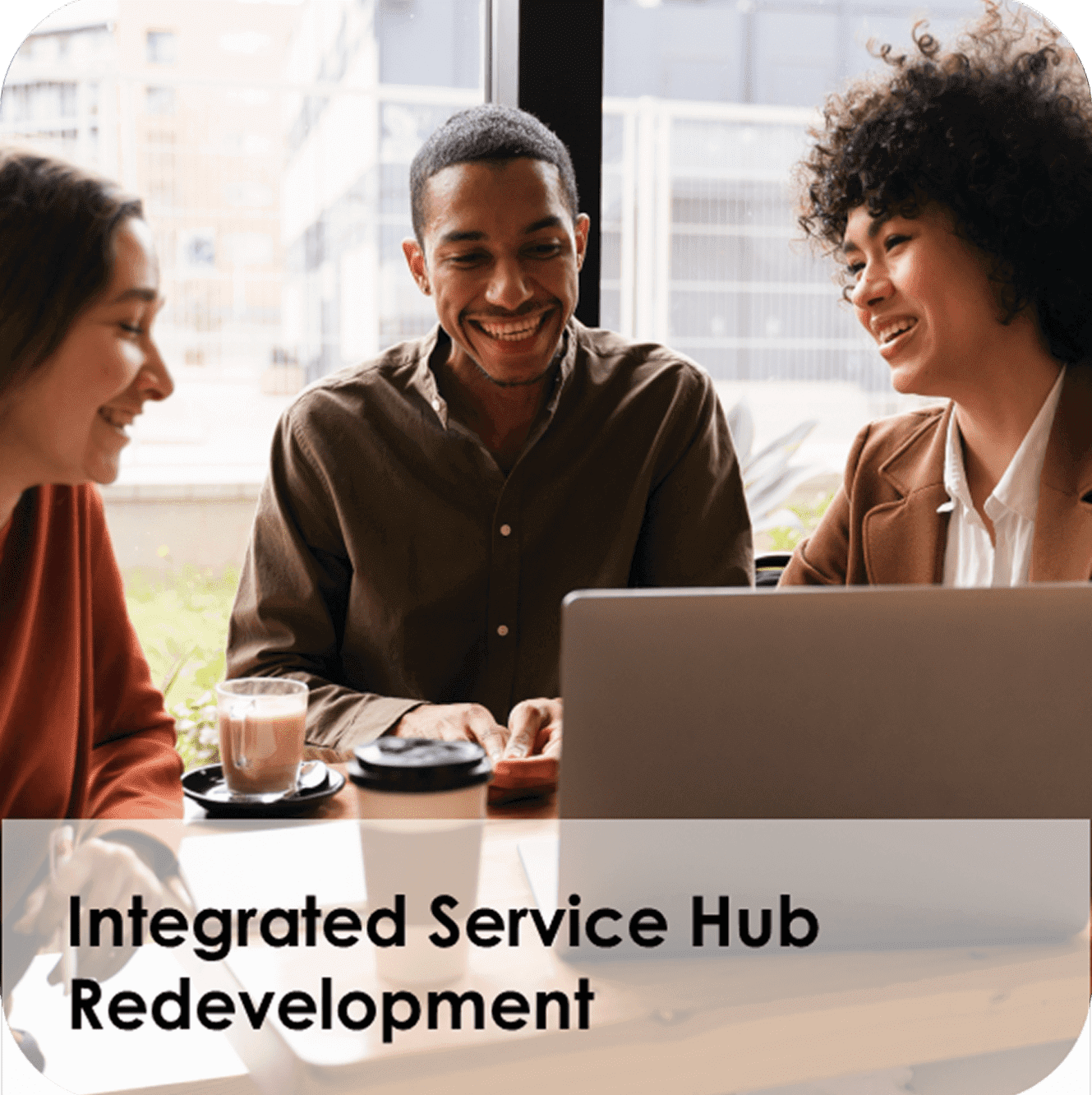 Colleagues collaborating around laptop with coffee