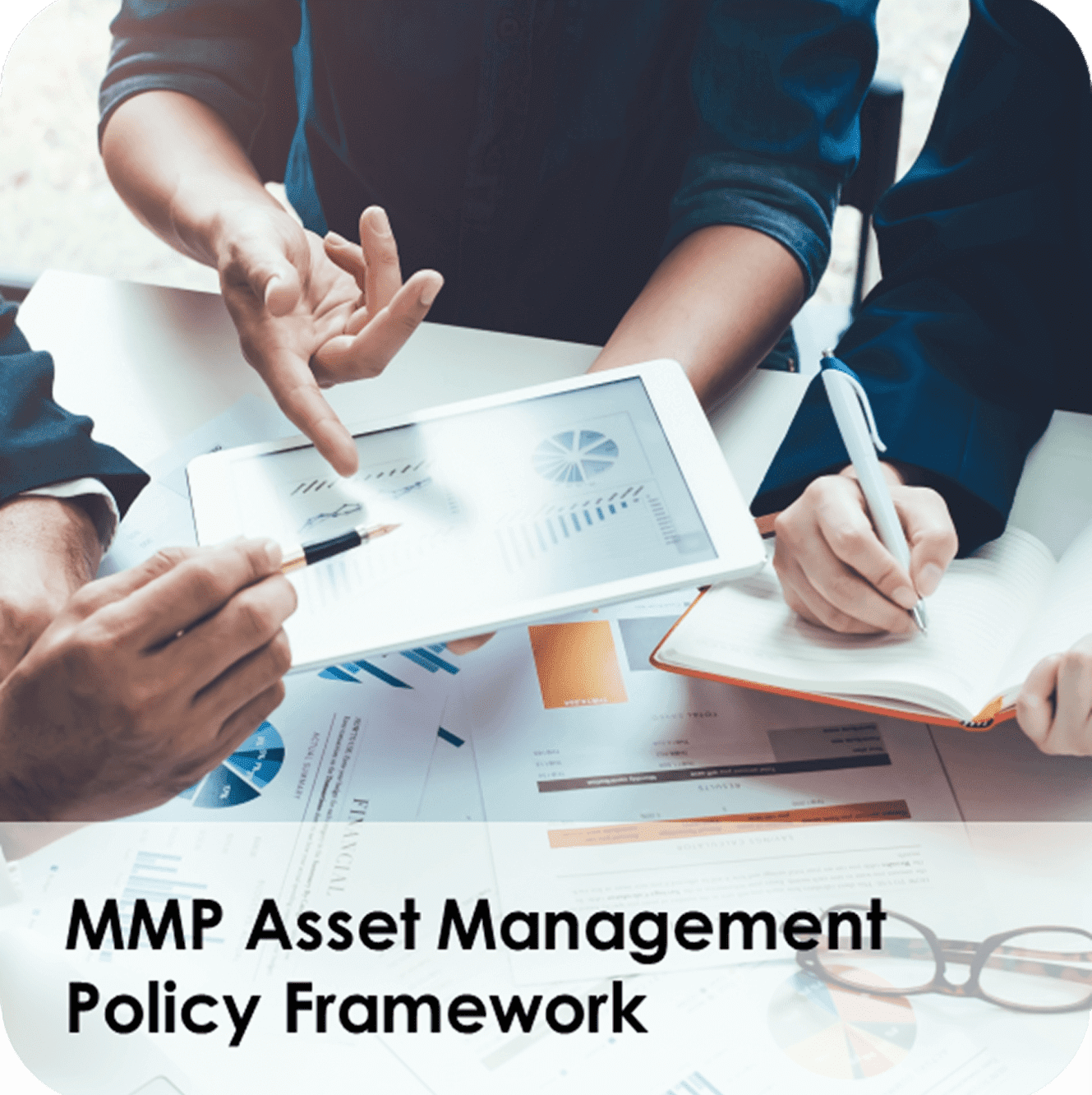 Asset management team reviewing tablet charts